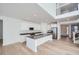 Modern kitchen with white cabinets, a large island, and stainless steel appliances at 4620 Thistle Dr, Brighton, CO 80601