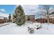 Peaceful backyard with a snow covered patio area at 5035 W 32Nd Ave, Denver, CO 80212