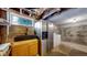 Basement laundry area with sink and refrigerator at 5035 W 32Nd Ave, Denver, CO 80212