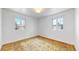 Well-lit bedroom featuring hardwood floors and a decorative rug at 5035 W 32Nd Ave, Denver, CO 80212