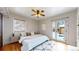 Spacious bedroom with hardwood floors, french doors, and ceiling fan at 5035 W 32Nd Ave, Denver, CO 80212