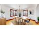 Bright dining room with hardwood floors and a stylish light fixture at 5035 W 32Nd Ave, Denver, CO 80212