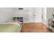 Bright bedroom with hardwood floors, closet and natural light at 1800 Grove St, Denver, CO 80204