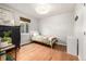 Neutral bedroom with hardwood floors, window, and ample natural light at 1800 Grove St, Denver, CO 80204
