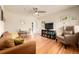 Inviting living room features hardwood floors, a ceiling fan, and comfortable seating arrangement at 1800 Grove St, Denver, CO 80204