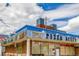 Exterior view of Pizza Alley, a pizzeria established in 1976 with vintage signage at 1800 Grove St, Denver, CO 80204