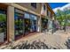 A charming view of several store fronts on a sunny day with pedestrian walkway at 1800 Grove St, Denver, CO 80204