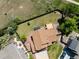 An overhead view of a well-maintained backyard with a deck, patio, gazebo, and mature trees at 3968 Ashcroft Ave, Castle Rock, CO 80104