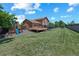 A spacious backyard with a deck, gazebo, a playground and a well-maintained lawn at 3968 Ashcroft Ave, Castle Rock, CO 80104