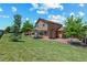 A spacious backyard with a well-maintained lawn, gazebo and a deck, perfect for outdoor enjoyment at 3968 Ashcroft Ave, Castle Rock, CO 80104