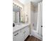 Bright bathroom featuring a shower-over-tub with a white shower curtain and single sink vanity at 3968 Ashcroft Ave, Castle Rock, CO 80104