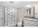 A well-lit bathroom with a walk-in shower, toilet, and granite vanity with a white basin at 3968 Ashcroft Ave, Castle Rock, CO 80104