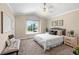This cozy bedroom boasts a ceiling fan, a large window and a comfortable queen-sized bed at 3968 Ashcroft Ave, Castle Rock, CO 80104