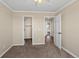 Bedroom featuring neutral walls, carpeting, open closet and doorway views of the hallway and bedroom at 3968 Ashcroft Ave, Castle Rock, CO 80104