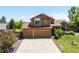 Charming two-story home featuring a well-maintained lawn and a spacious two-car garage at 3968 Ashcroft Ave, Castle Rock, CO 80104