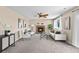 Living room features a brick fireplace, ceiling fan, plush sofas and a window at 3968 Ashcroft Ave, Castle Rock, CO 80104