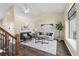 Bright living room with vaulted ceilings, elegant decor, and beautiful flooring at 3968 Ashcroft Ave, Castle Rock, CO 80104