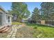 Spacious backyard with a play area, shed, and patio perfect for outdoor enjoyment at 10064 Owens St, Broomfield, CO 80021