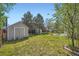 Well-maintained backyard featuring a shed, trampoline, and outdoor seating area at 10064 Owens St, Broomfield, CO 80021