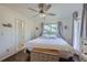 Cozy bedroom featuring hardwood floors, a comfortable bed, and bright natural light at 10064 Owens St, Broomfield, CO 80021