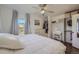 Bright bedroom featuring hardwood floors, a closet, and a white dresser at 10064 Owens St, Broomfield, CO 80021