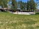 A spacious community pool surrounded by lush greenery shows a relaxing atmosphere and recreational opportunities at 10064 Owens St, Broomfield, CO 80021