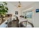 Bright breakfast nook off kitchen with bay window and ceiling fan at 10064 Owens St, Broomfield, CO 80021