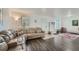 Inviting living room with wood floors, neutral decor, and ample seating at 10064 Owens St, Broomfield, CO 80021