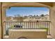 This balcony overlooks neighborhood parking, offering a convenient outdoor space at 8757 E Dry Creek Rd # 1528, Englewood, CO 80112