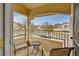 Private balcony offers a relaxed outdoor space with seating and views of the neighborhood at 8757 E Dry Creek Rd # 1528, Englewood, CO 80112