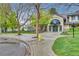 Inviting building exterior surrounded by lush landscaping and mature trees, and a fire hydrant at 8757 E Dry Creek Rd # 1528, Englewood, CO 80112