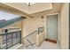 Upstairs condo entrance with a welcoming doormat and clear unit number at 8757 E Dry Creek Rd # 1528, Englewood, CO 80112