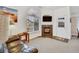 Cozy living room featuring a fireplace, large window, and comfortable seating area at 8757 E Dry Creek Rd # 1528, Englewood, CO 80112