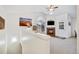 Bright living room with vaulted ceilings, fireplace, and carpeted floors at 8757 E Dry Creek Rd # 1528, Englewood, CO 80112