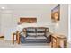 Cozy living room with a comfortable black sofa, and stylish side tables at 8757 E Dry Creek Rd # 1528, Englewood, CO 80112