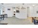 Open concept living area featuring neutral colors and seamless carpet flooring at 8757 E Dry Creek Rd # 1528, Englewood, CO 80112