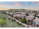 Beautiful aerial view of the neighborhood with stunning mountain views at sunset at 10601 Montecito Dr, Lone Tree, CO 80124