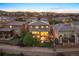 Backyard view featuring a multi-tiered deck, lawn, and neighborhood landscape in a comfortable suburban setting at 10601 Montecito Dr, Lone Tree, CO 80124