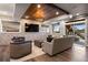Finished basement with stone accent wall, media center, and walkout access at 10601 Montecito Dr, Lone Tree, CO 80124