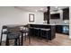 Charming basement wet bar with seating and granite countertops for entertaining in this lovely home at 10601 Montecito Dr, Lone Tree, CO 80124