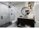 Luxurious bathroom featuring modern tile design, glass shower, and designer vanity at 10601 Montecito Dr, Lone Tree, CO 80124
