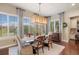 Well-lit dining room with a modern chandelier and large windows at 10601 Montecito Dr, Lone Tree, CO 80124