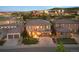 View of the attractive two-story home and well-maintained front yard, complemented by nearby neighborhood features at 10601 Montecito Dr, Lone Tree, CO 80124