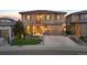 Charming two-story home with a manicured lawn, two-car garage, and a basketball hoop on the driveway at 10601 Montecito Dr, Lone Tree, CO 80124