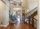 Grand foyer with hardwood floors, a staircase, and elegant chandelier at 10601 Montecito Dr, Lone Tree, CO 80124