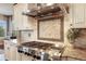 Gourmet kitchen with stainless steel range and custom backsplash at 10601 Montecito Dr, Lone Tree, CO 80124