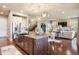 Open concept kitchen with large island, pendant lighting, and stainless steel appliances at 10601 Montecito Dr, Lone Tree, CO 80124