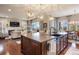 Spacious kitchen featuring a large island, modern pendant lighting, and stainless steel appliances at 10601 Montecito Dr, Lone Tree, CO 80124
