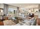Bright open concept living room with hardwood floors and lots of natural light at 10601 Montecito Dr, Lone Tree, CO 80124