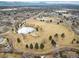 Beautiful aerial view of a neighborhood park complete with walking trails and pond at 1492 S Dudley St, Lakewood, CO 80232